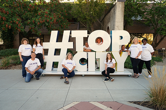 2018 UWGT Campaign Ambassadors with TopCity hashtag sign